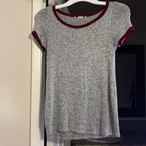 Grey and black speckled shirt with red outlines